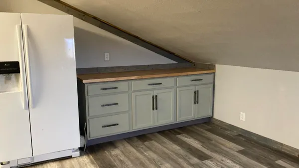 a stove top oven sitting inside of a kitchen