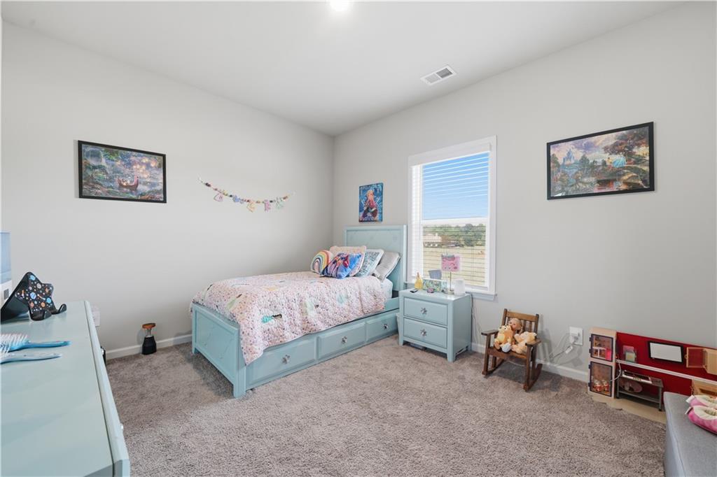 1269 Covered Bridge Road Covington, GA 30016 - Photo 20 of 31 a bedroom with a bed and a window