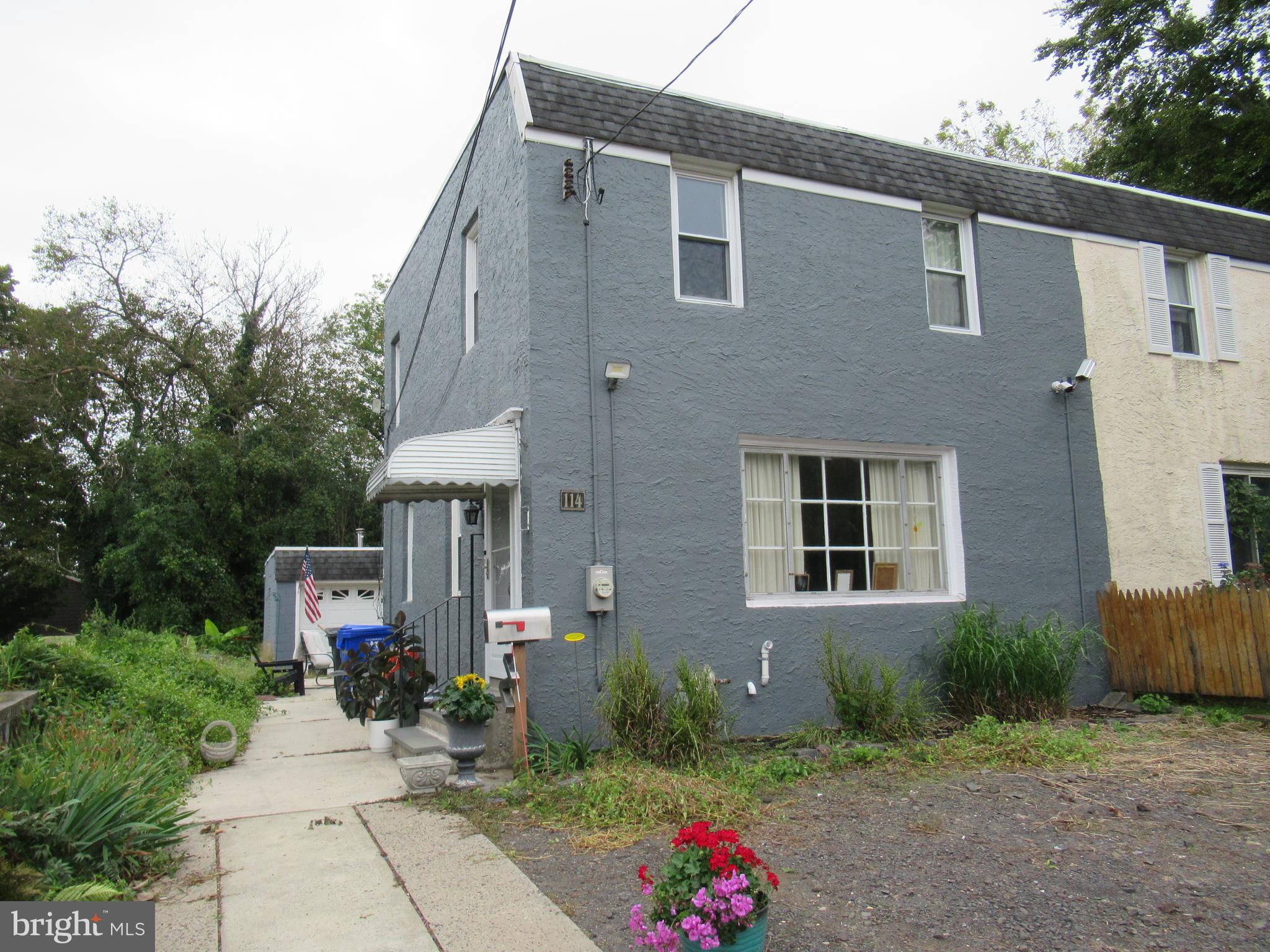 114 Cottman Avenue Cheltenham, PA 19012 - Photo 1 of 8 a front view of a house with a garden