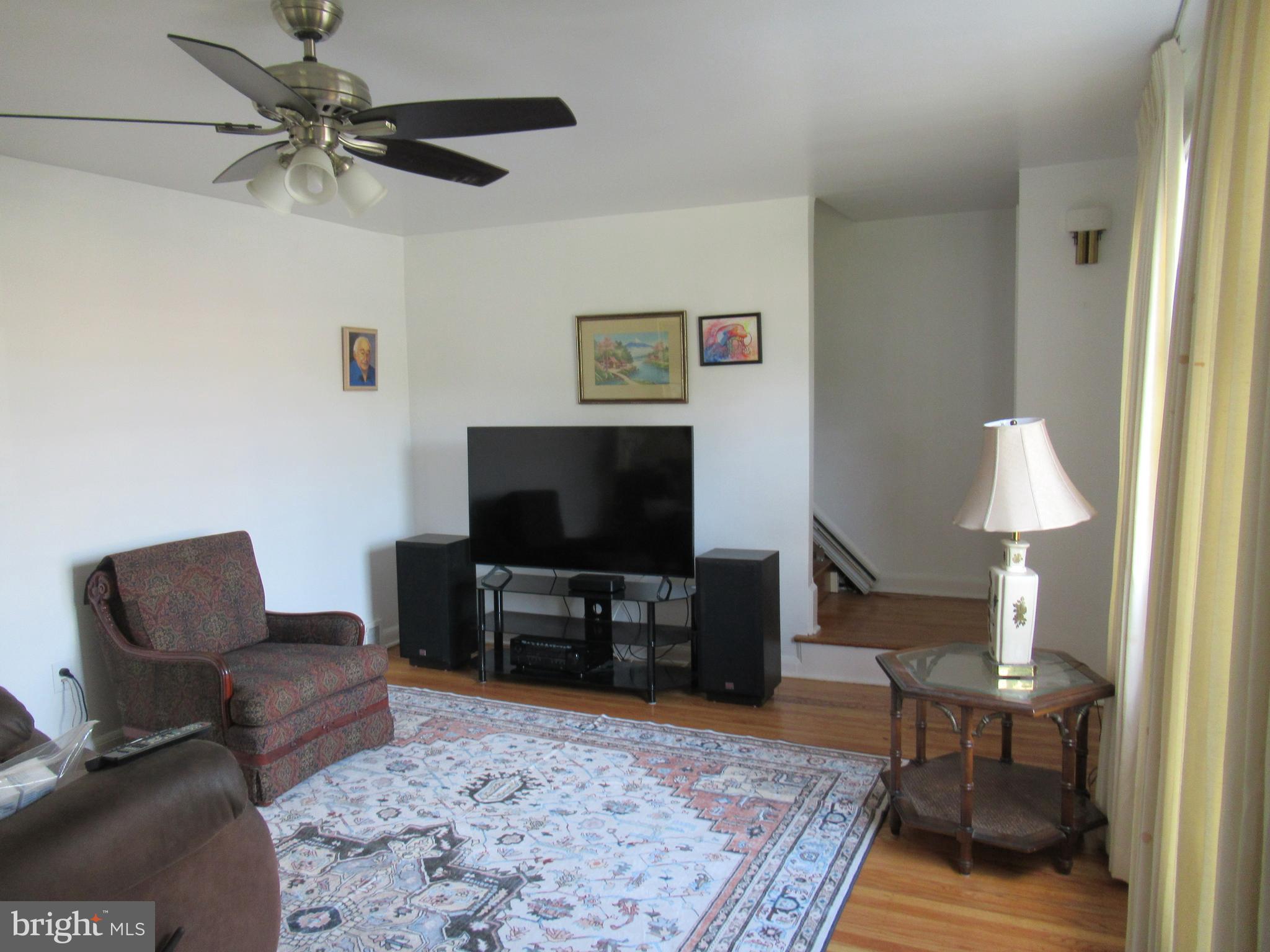 114 Cottman Avenue Cheltenham, PA 19012 - Photo 8 of 8 a living room with furniture and a flat screen tv