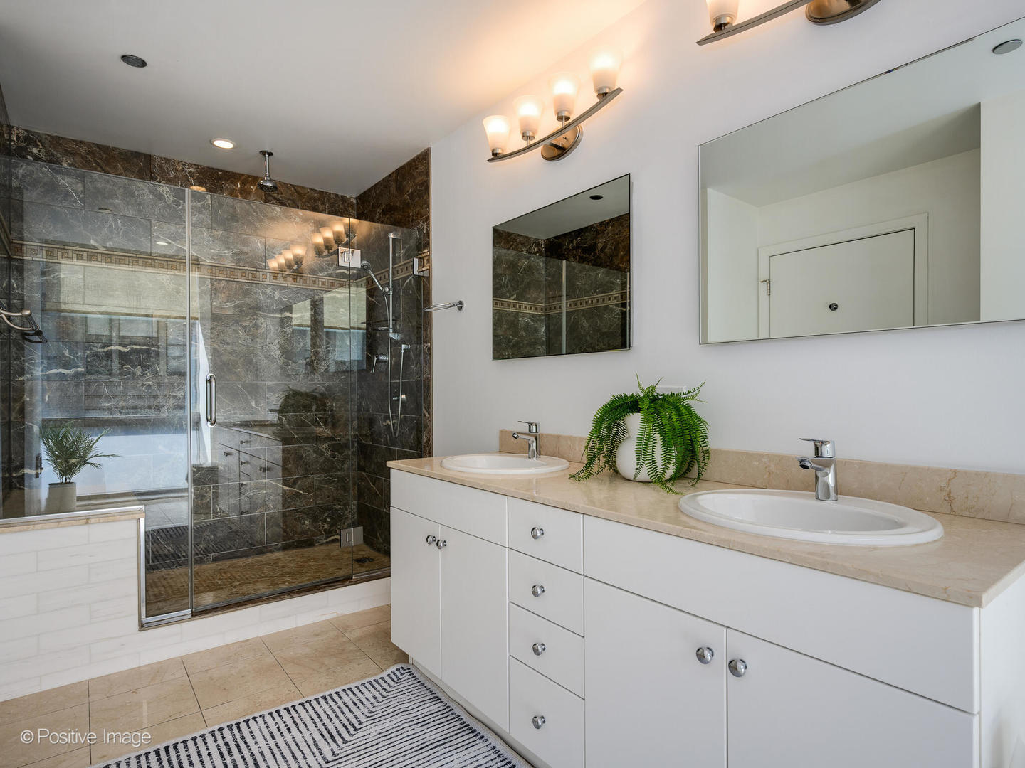 8 East Randolph Street, Unit 1208 Chicago, IL 60601 - Photo 13 of 27 a bathroom with double vanity and a shower