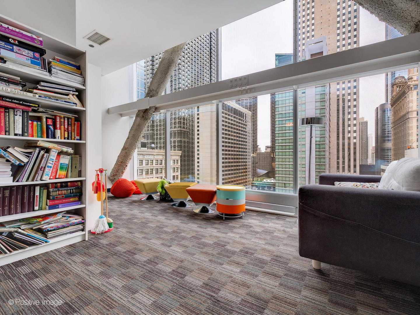 8 East Randolph Street, Unit 1208 Chicago, IL 60601 - Photo 23 of 27 a living room with furniture and a book shelf