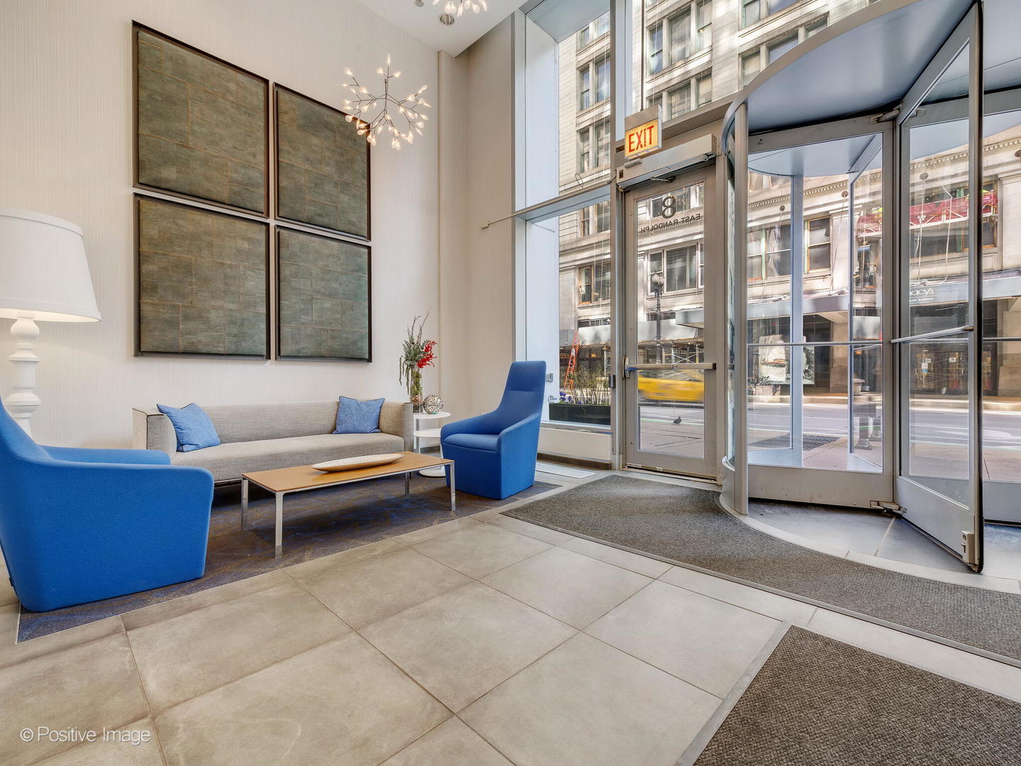 8 East Randolph Street, Unit 1208 Chicago, IL 60601 - Photo 26 of 27 a living room with furniture a rug and white walls