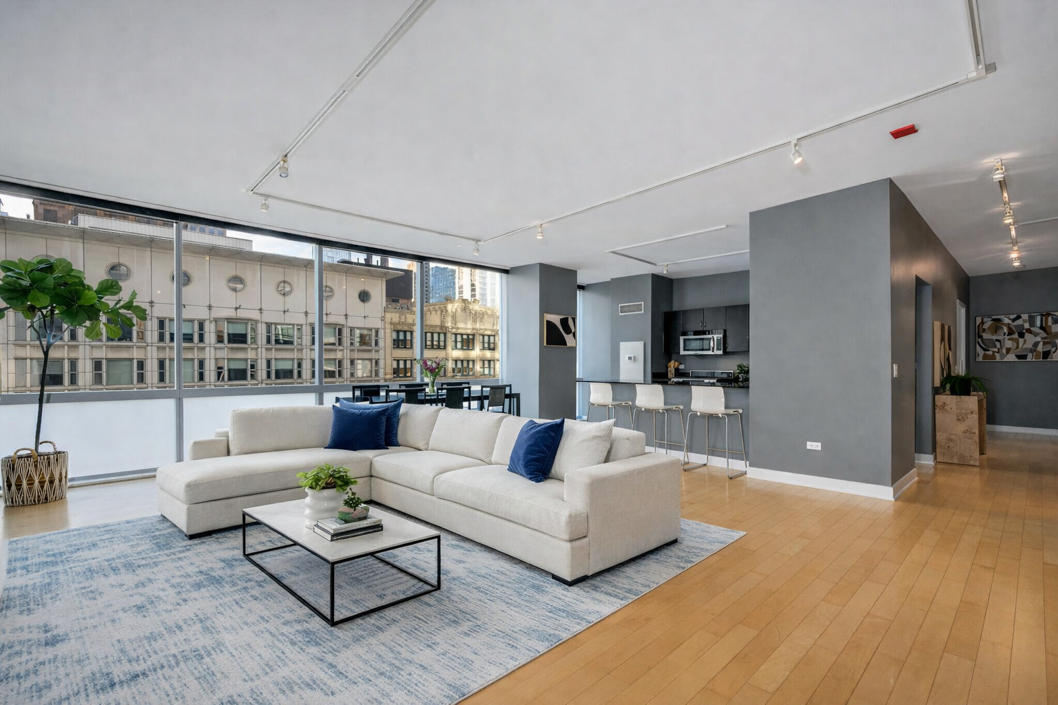 8 East Randolph Street, Unit 1208 Chicago, IL 60601 - Photo 3 of 27 a living room with furniture and a large window