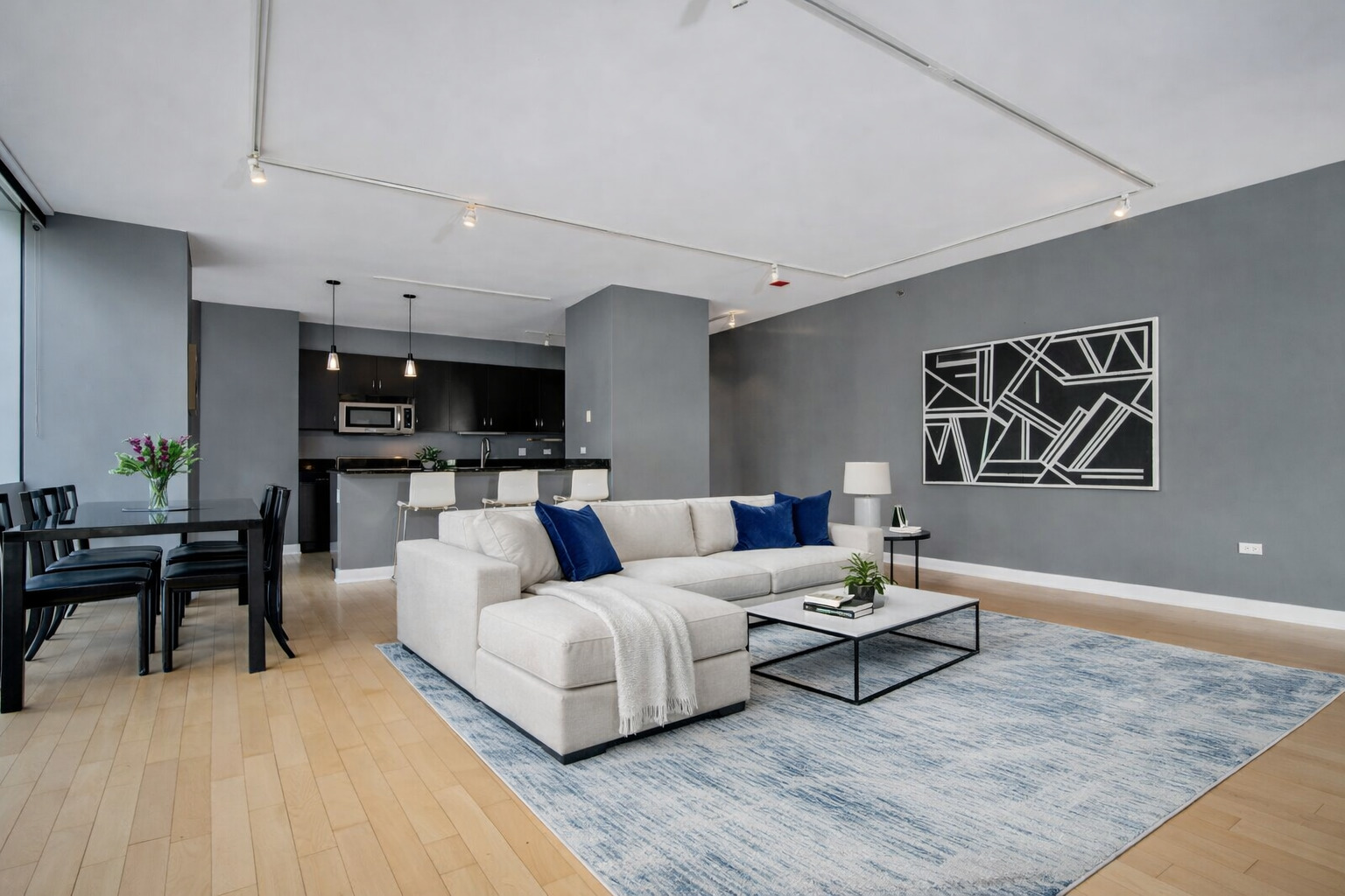 8 East Randolph Street, Unit 1208 Chicago, IL 60601 - Photo 4 of 27 a living room with furniture and wooden floor