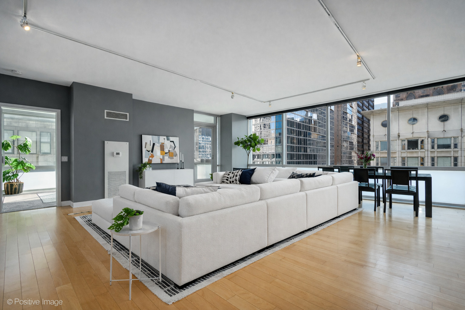 8 East Randolph Street, Unit 1208 Chicago, IL 60601 - Photo 5 of 27 a living room with furniture and a large window