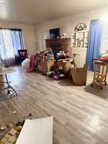 a view of a livingroom with furniture and toys
