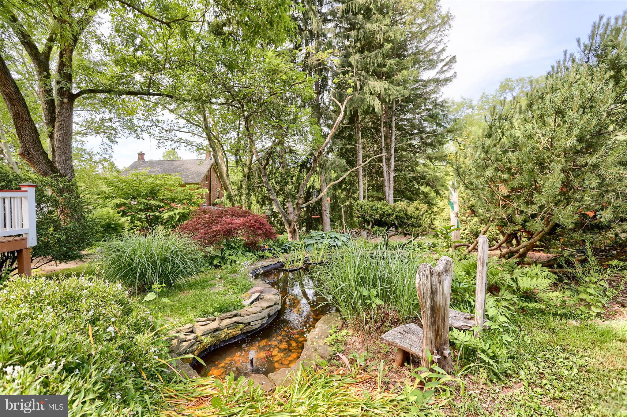 5531 Spring Road Shermans Dale, PA 17090 - Photo 46 of 76 Relax by the fish pond with a glass of wine!