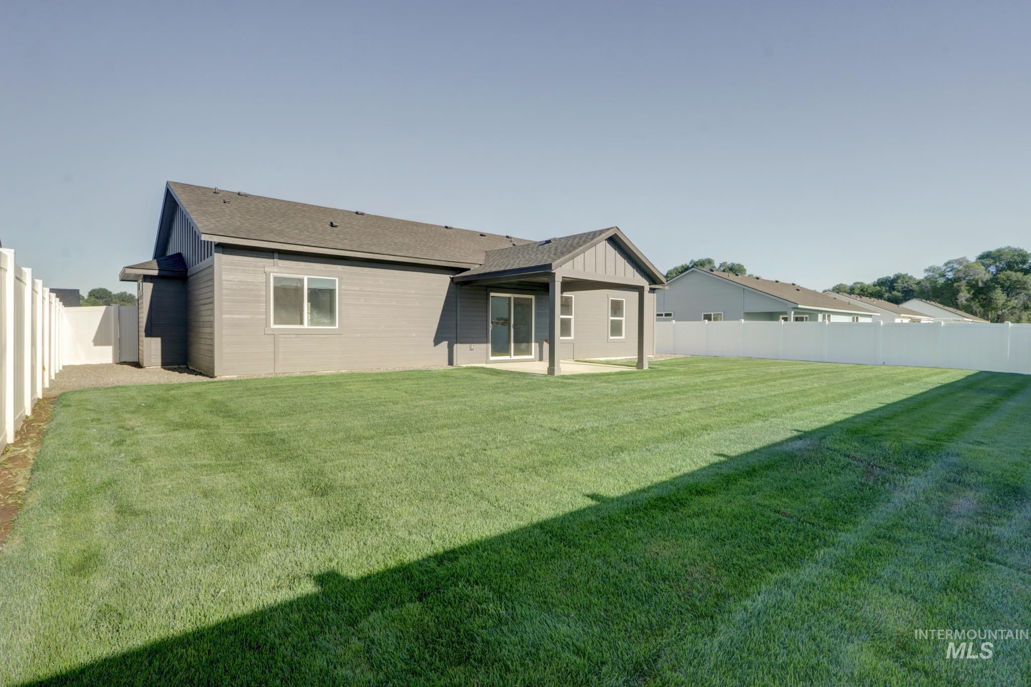 848 North 5th Street Nyssa, OR 97913 - Photo 41 of 49 Expansive green lawn with a white privacy fence