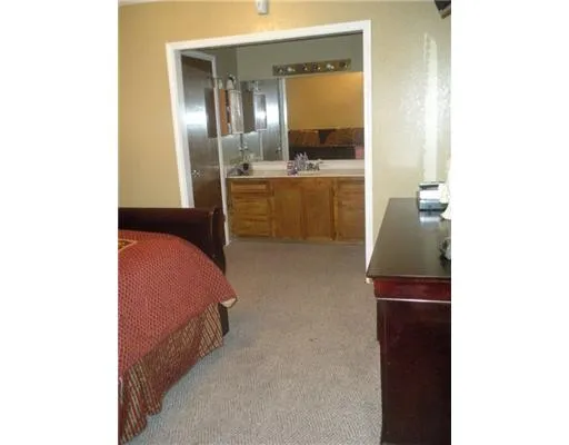 a en suite bathroom with a sink and a mirror