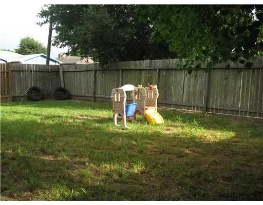 a swimming pool with wooden fence