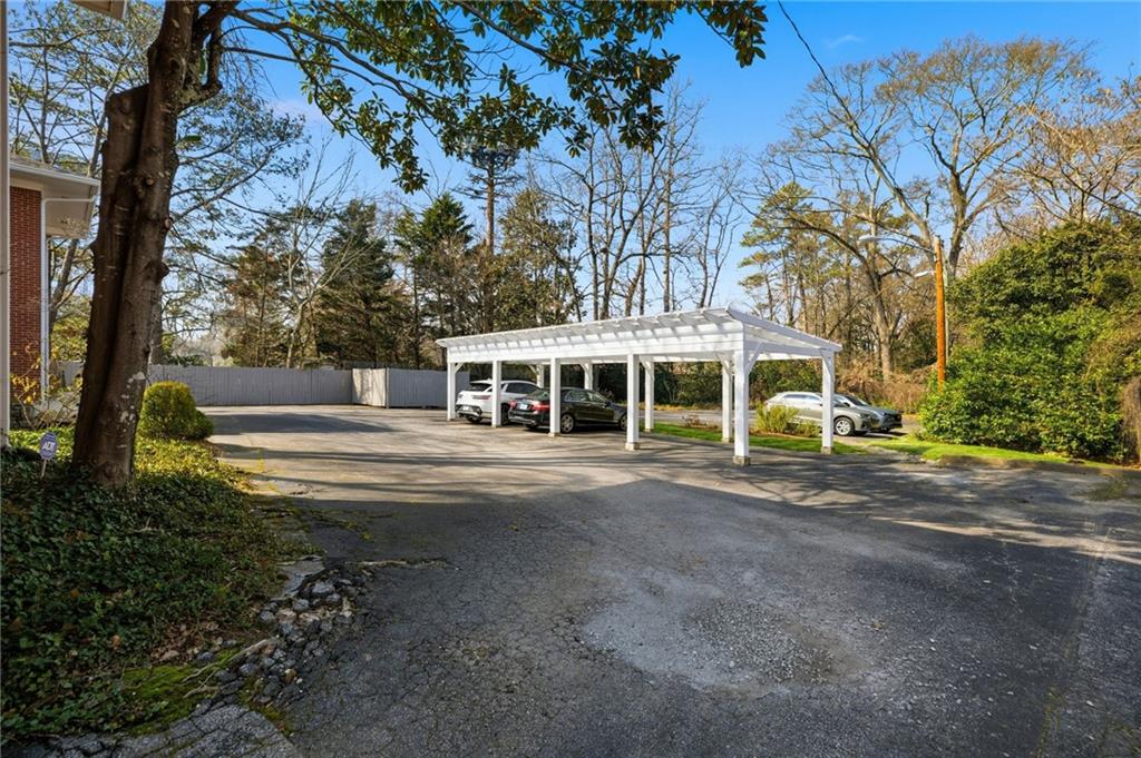 3694 Peachtree Road Northeast, Unit A4 Atlanta, GA 30319 - Photo 16 of 17 a front view of a house with a yard