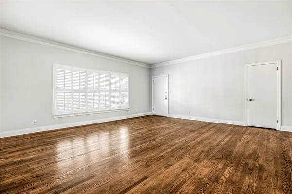 an empty room with wooden floor