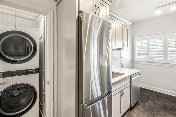 a view of a kitchen with washer and dryer