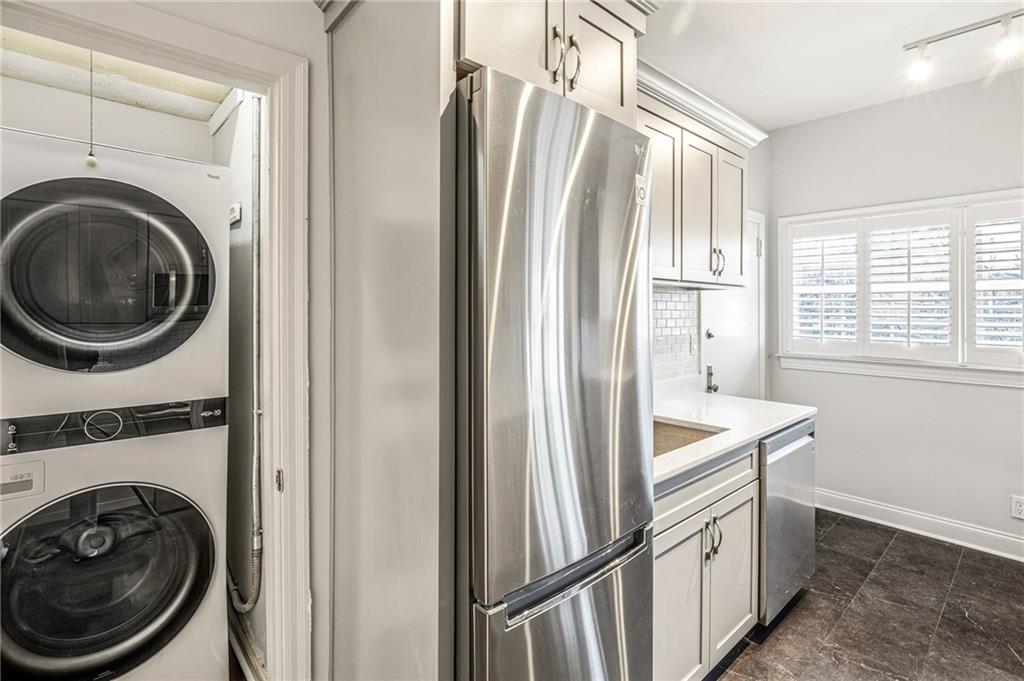 3694 Peachtree Road Northeast, Unit A4 Atlanta, GA 30319 - Photo 9 of 17 a view of a kitchen with washer and dryer