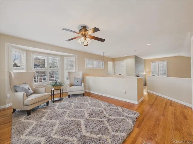 a bedroom with a bed and a painting