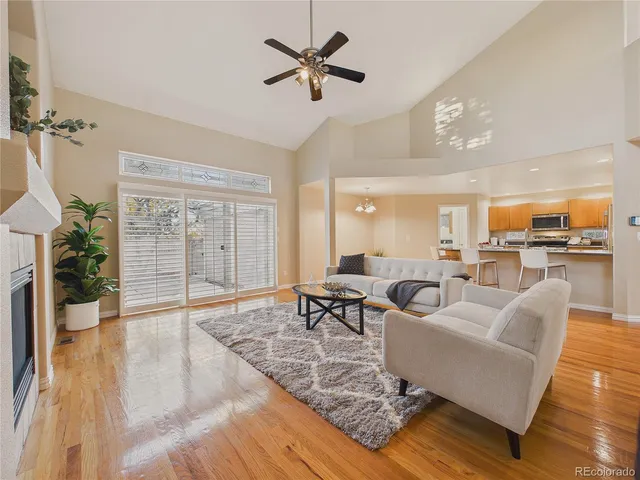 a bathroom with a granite countertop sink toilet and mirror