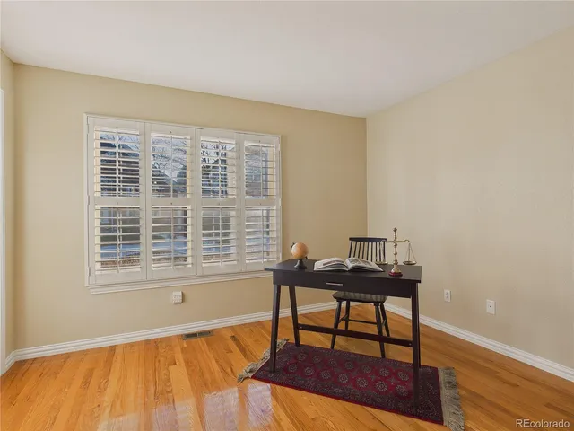 a kitchen with granite countertop a refrigerator and a sink