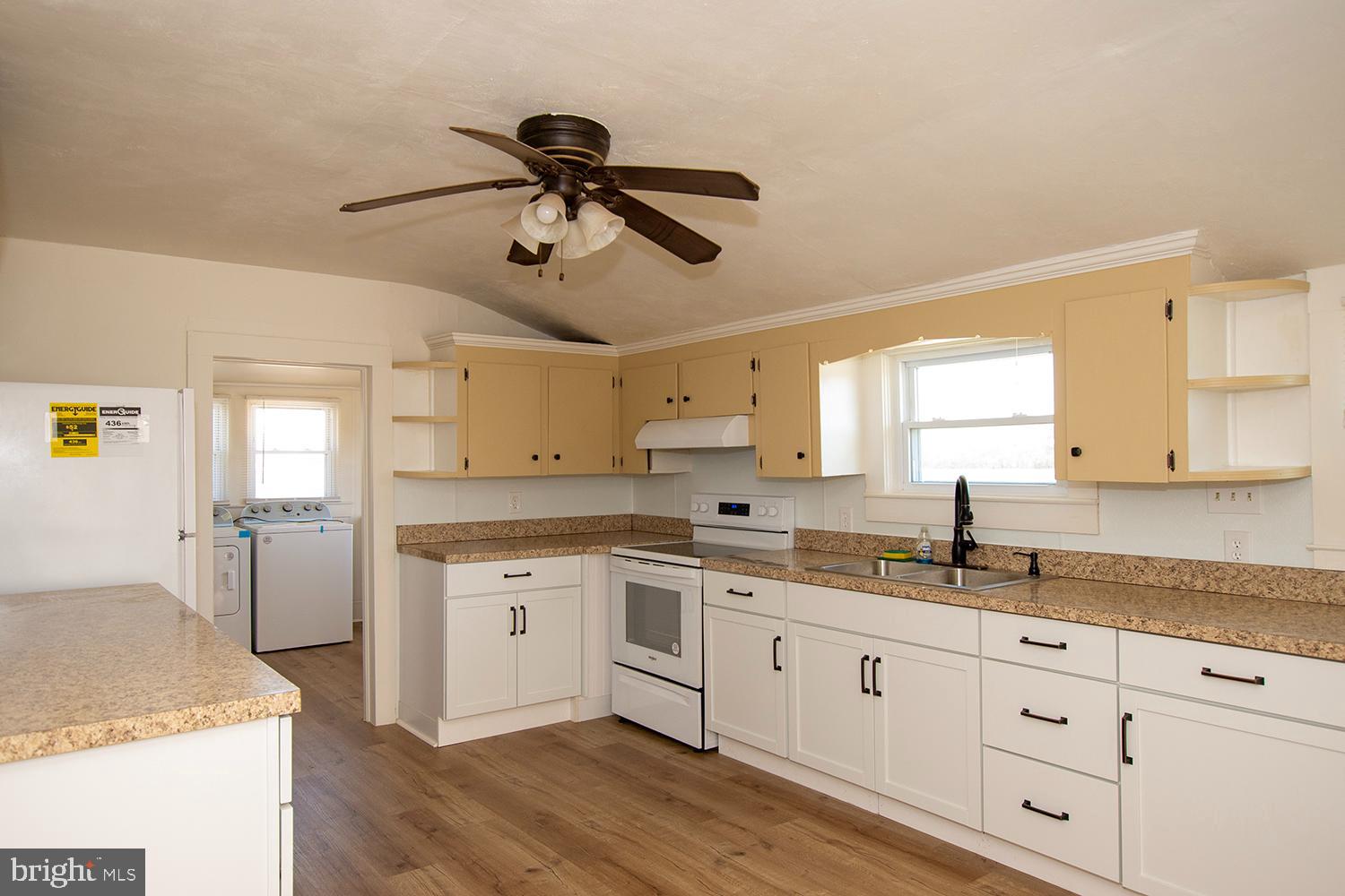 34463 Rider Road Delmar, DE 19940 - Photo 2 of 47 a kitchen with a sink window and cabinets