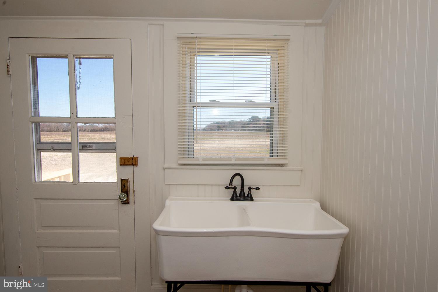 34463 Rider Road Delmar, DE 19940 - Photo 22 of 47 a white bath tub sitting in a bathroom next to a window