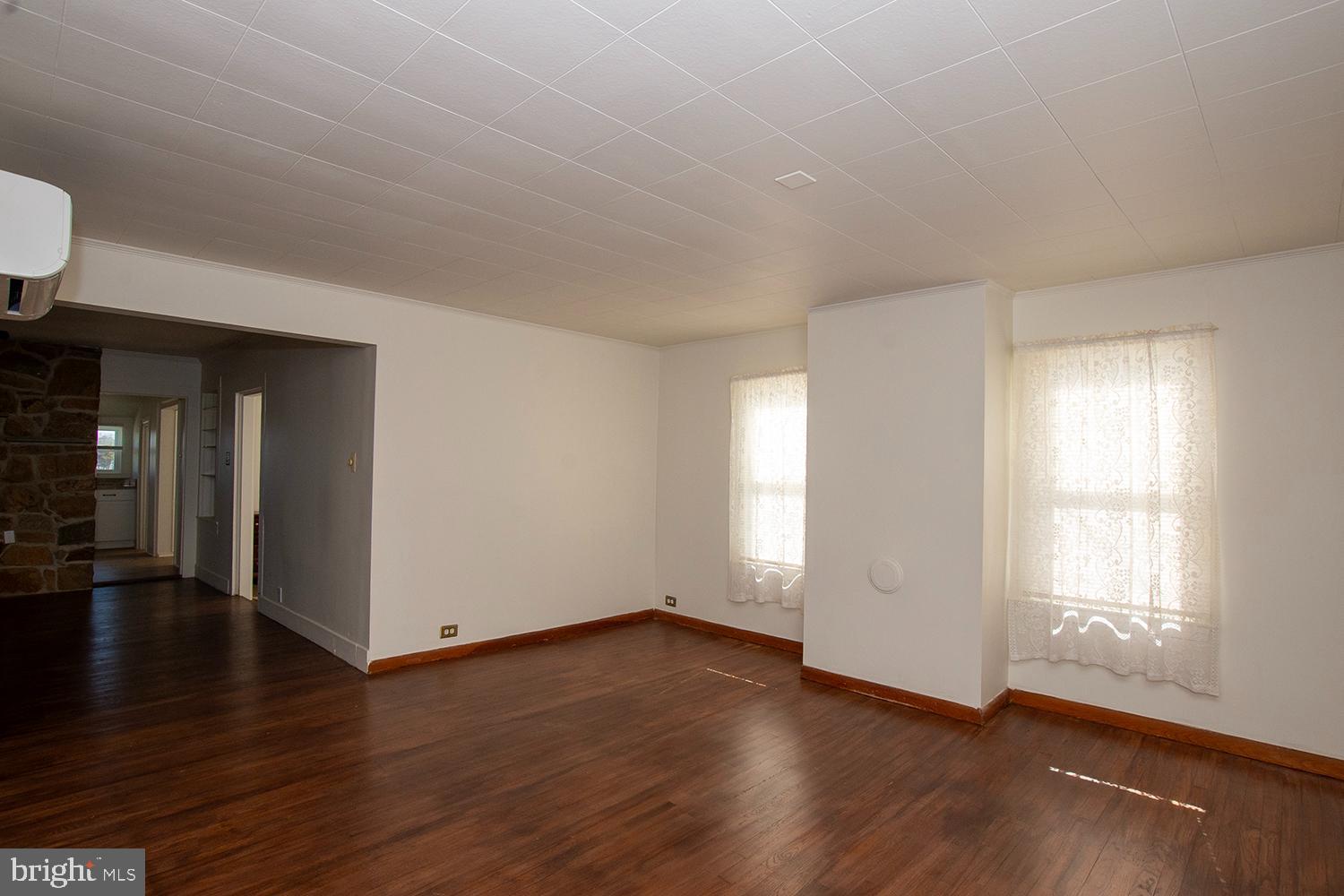 34463 Rider Road Delmar, DE 19940 - Photo 26 of 47 an empty room with wooden floor and windows