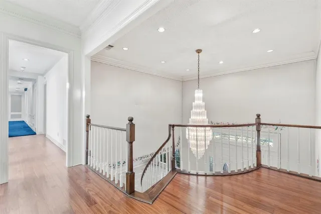 a view of hallway with wooden floor