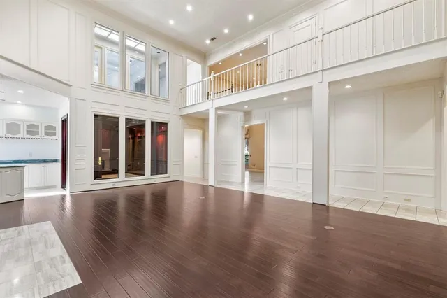 a view of an entryway with wooden floor