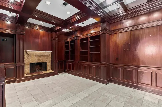 a view of an empty room with a fireplace