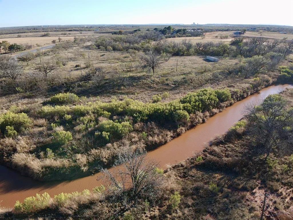 5900 West Lake Road Abilene, TX 79601 - Photo 6 of 19 a view of a bunch of trees and bushes