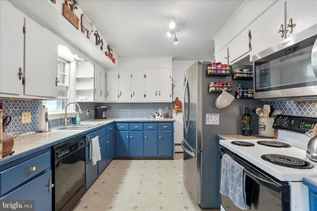 a kitchen with a stove and a refrigerator