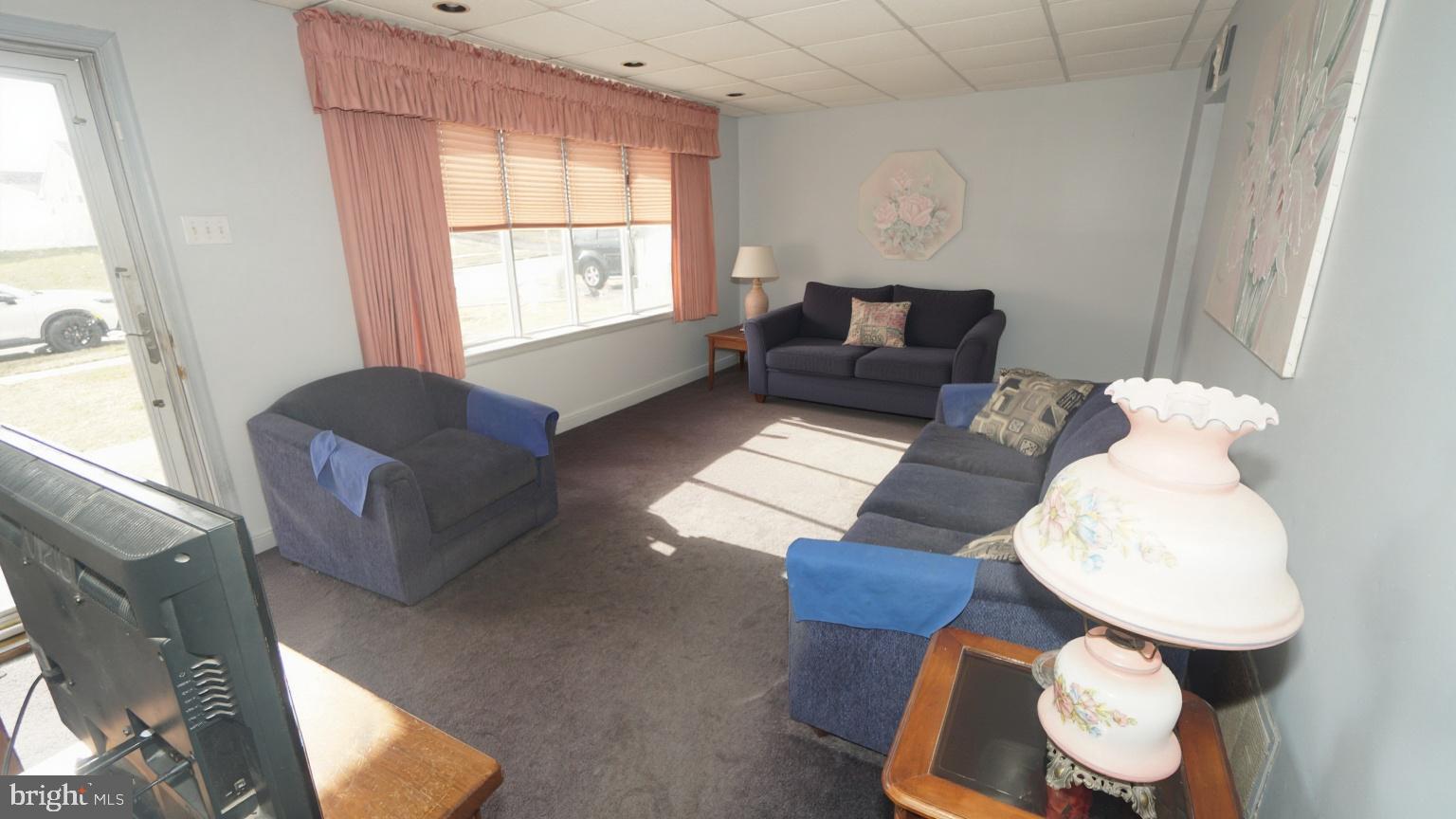 2832 Berwyn Road Bensalem, PA 19020 - Photo 6 of 12 a living room with furniture and a window