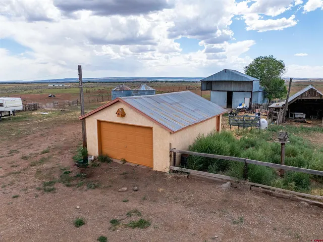 a view of a lake with tables and chairs