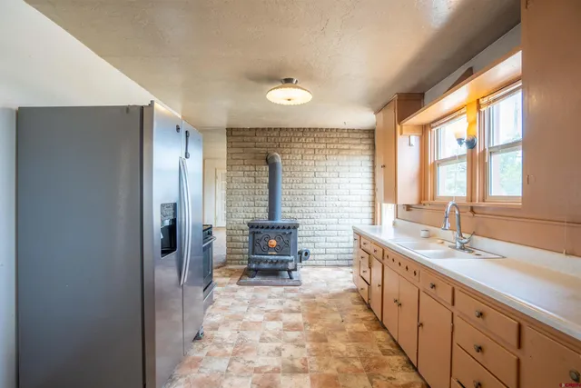 a large bathroom with a large tub and sink