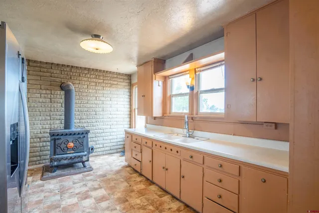 a spacious bathroom with a granite countertop sink mirror and a bathtub