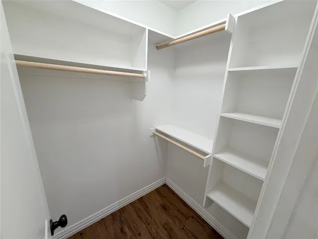 a view of an empty walk in closet