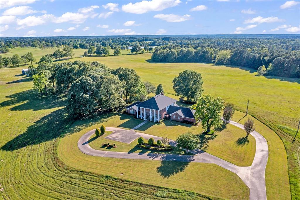 an aerial view of a house with a lake view