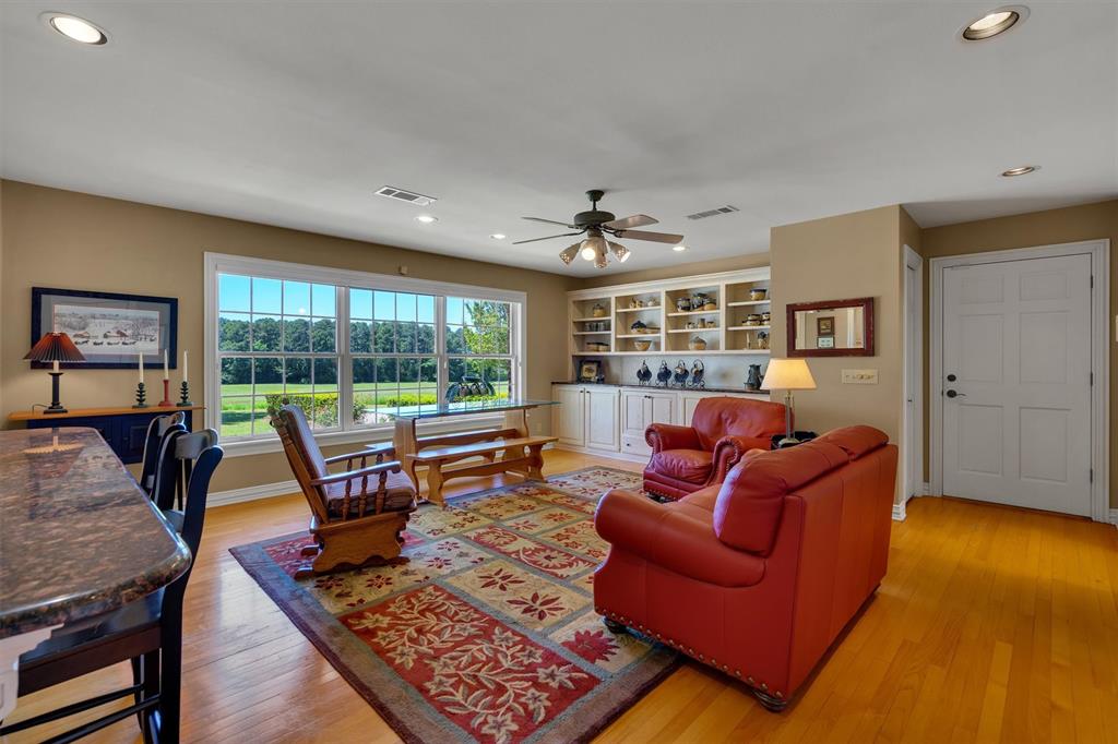 192301 North 4205th Road Antlers, OK 74523 - Photo 19 of 40 a living room with furniture and a floor to ceiling window
