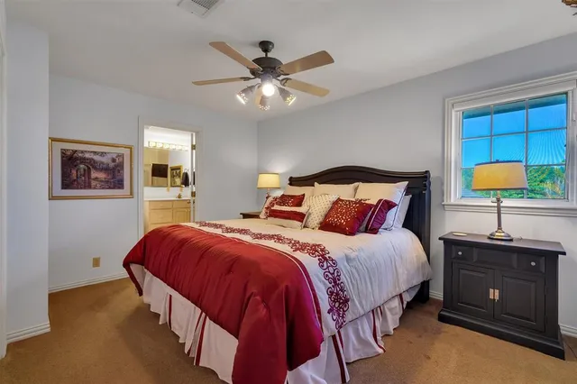 a kitchen with stainless steel appliances granite countertop a sink and a stove next to a window