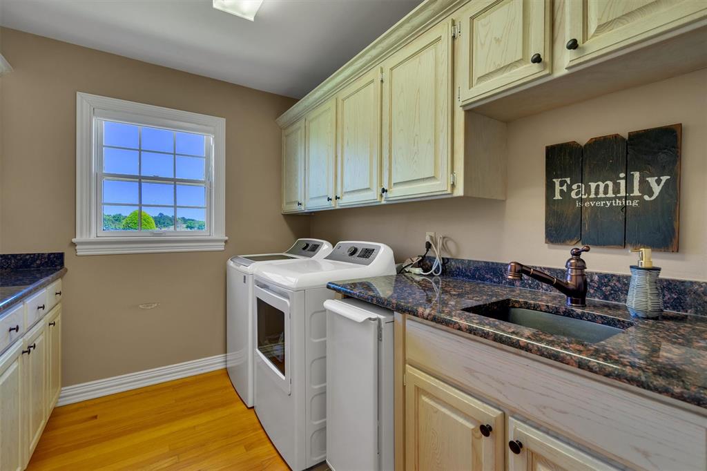 192301 North 4205th Road Antlers, OK 74523 - Photo 29 of 40 a kitchen with stainless steel appliances granite countertop a sink and a stove next to a window