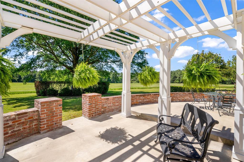 192301 North 4205th Road Antlers, OK 74523 - Photo 31 of 40 a view of a patio with a table chairs and a backyard