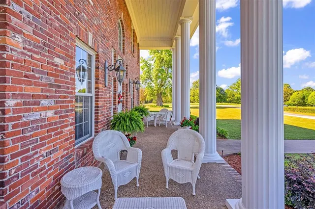 a view of balcony with furniture