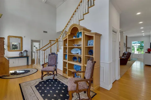 a view of living room and wooden floor
