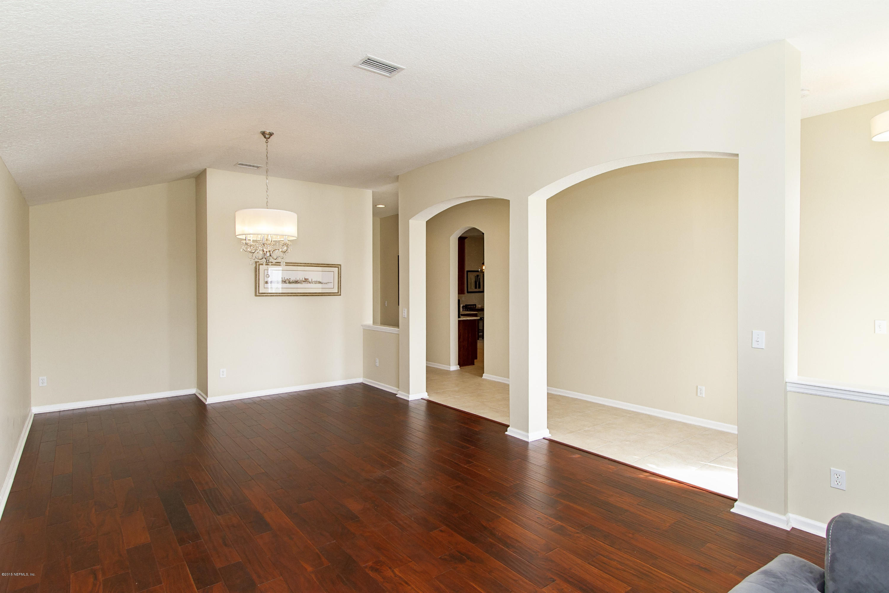 720 Porta Rosa Circle St. Augustine, FL 32092 - Photo 3 of 26 an empty room with wooden floor and windows