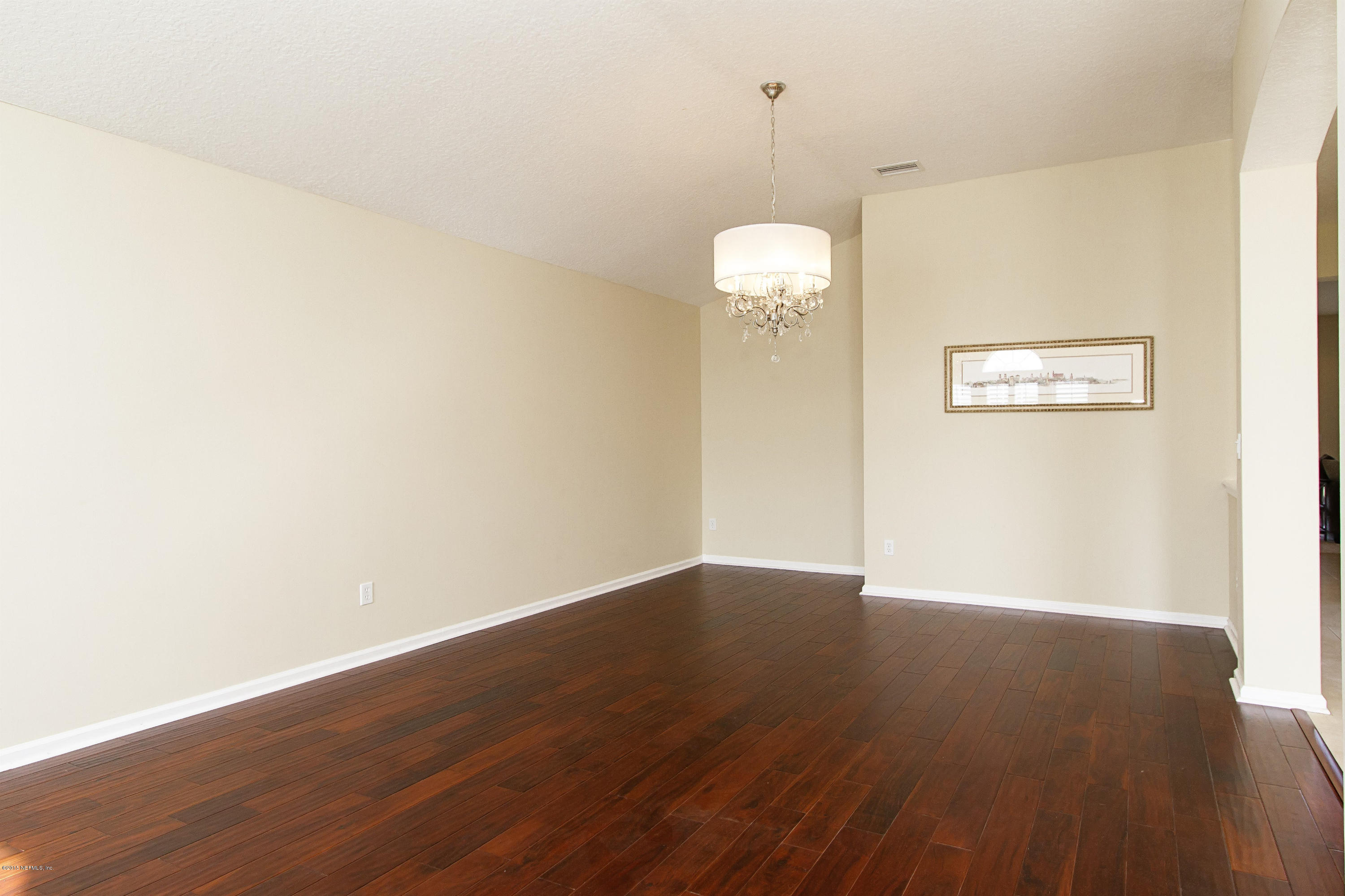 720 Porta Rosa Circle St. Augustine, FL 32092 - Photo 4 of 26 a view of an empty room with wooden floor