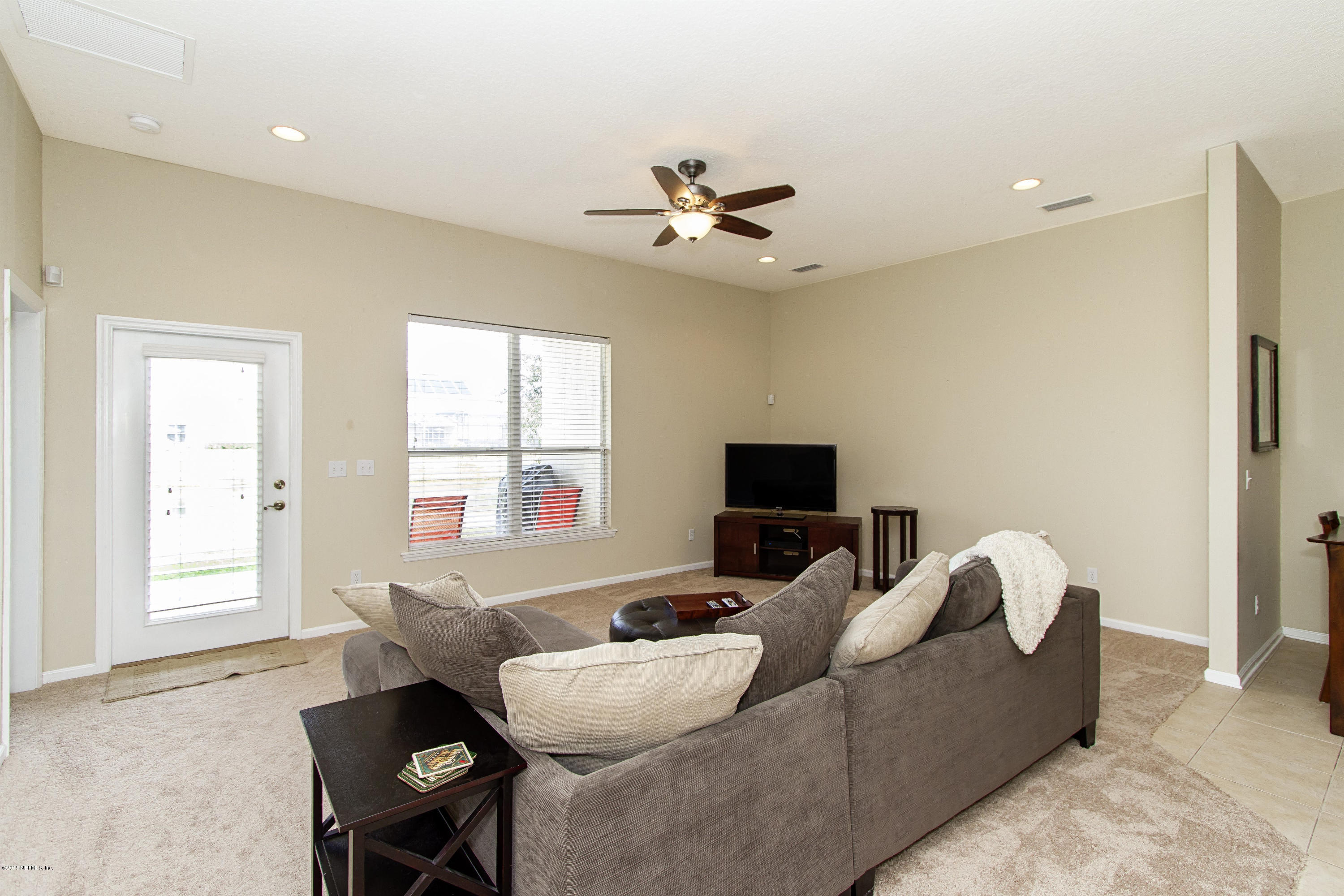 720 Porta Rosa Circle St. Augustine, FL 32092 - Photo 5 of 26 a living room with furniture and a flat screen tv
