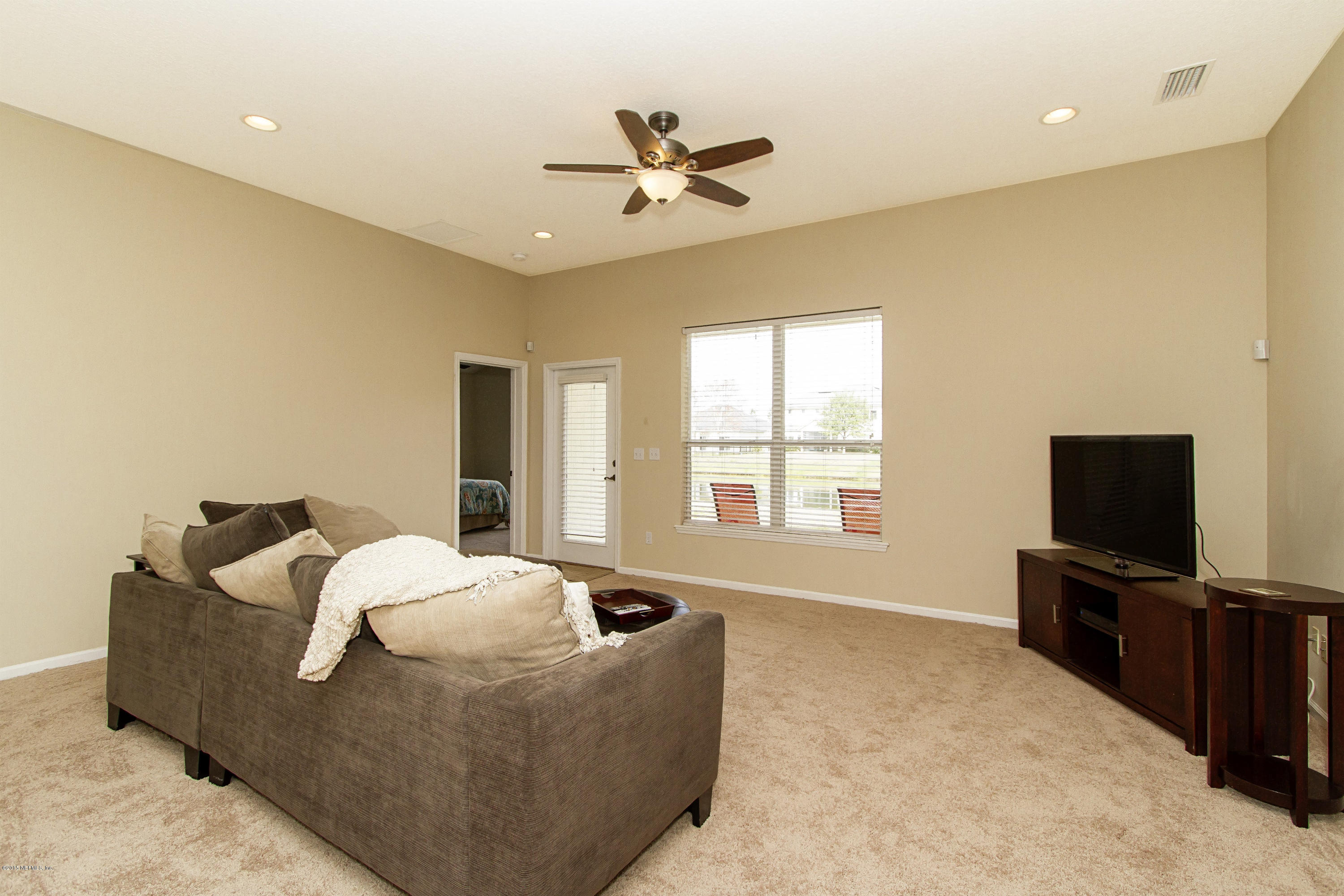 720 Porta Rosa Circle St. Augustine, FL 32092 - Photo 6 of 26 a living room with furniture and a flat screen tv