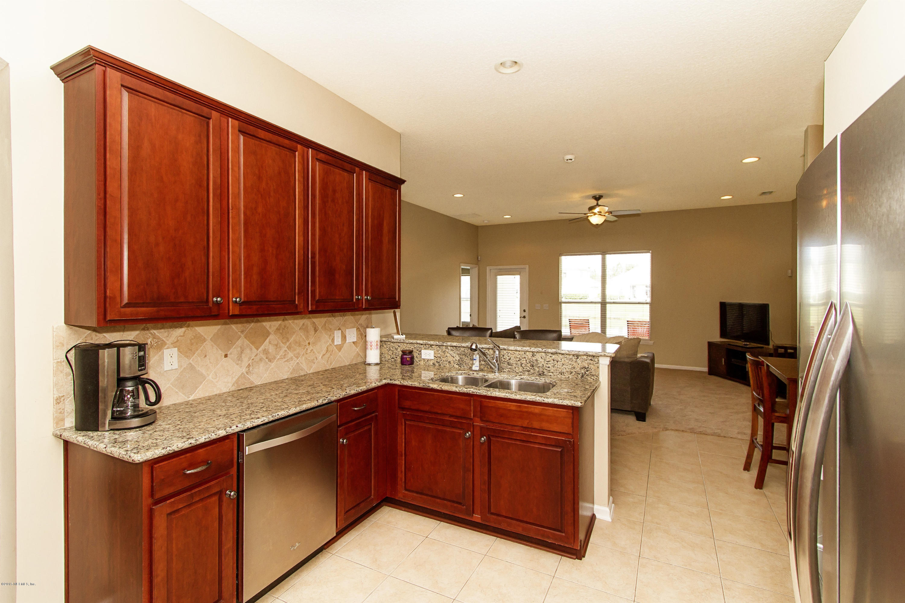720 Porta Rosa Circle St. Augustine, FL 32092 - Photo 10 of 26 a kitchen with a sink cabinets and window