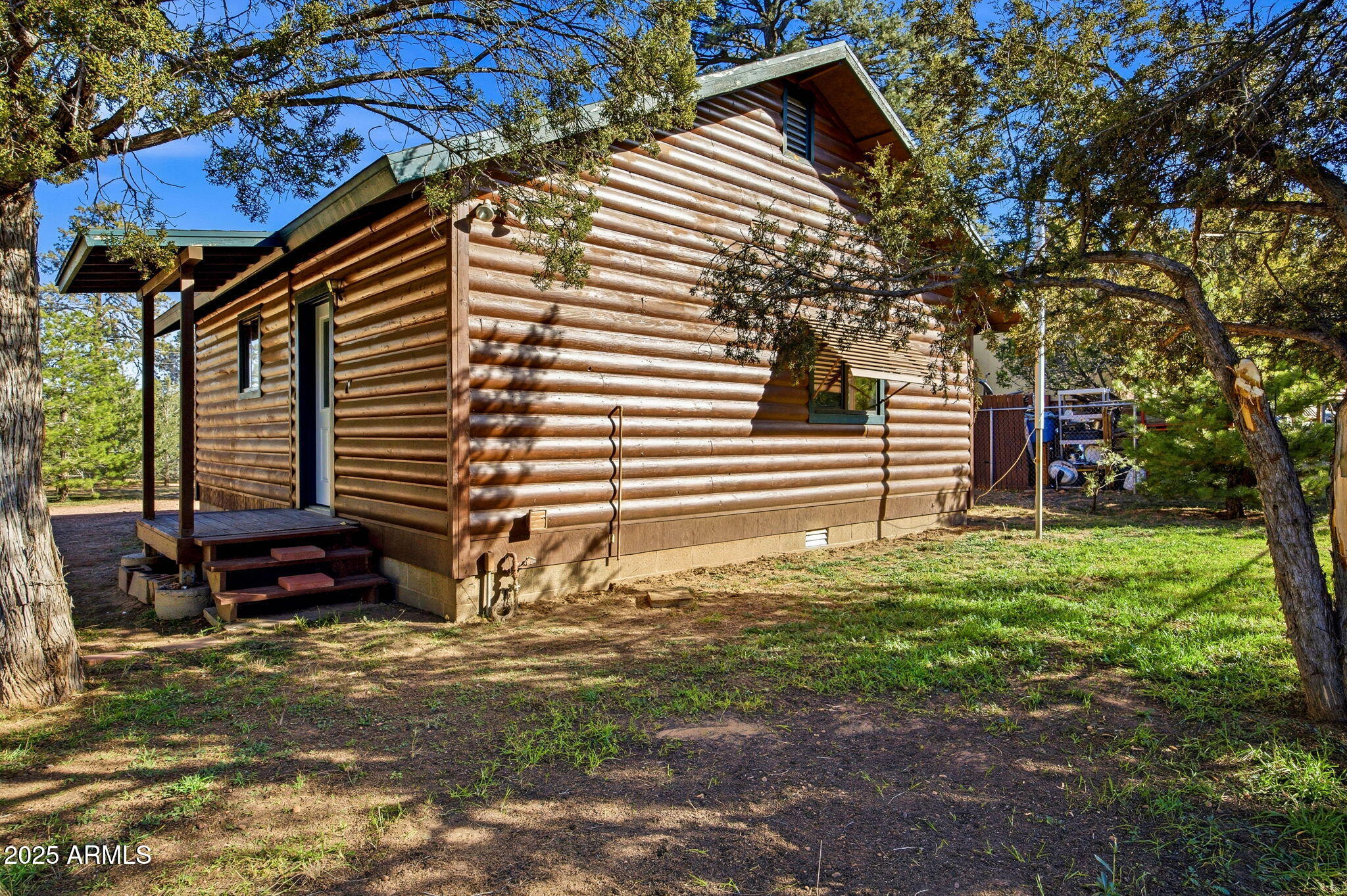 3157 Tonto Drive Overgaard, AZ 85933 - Photo 18 of 22 a front view of a house with a yard