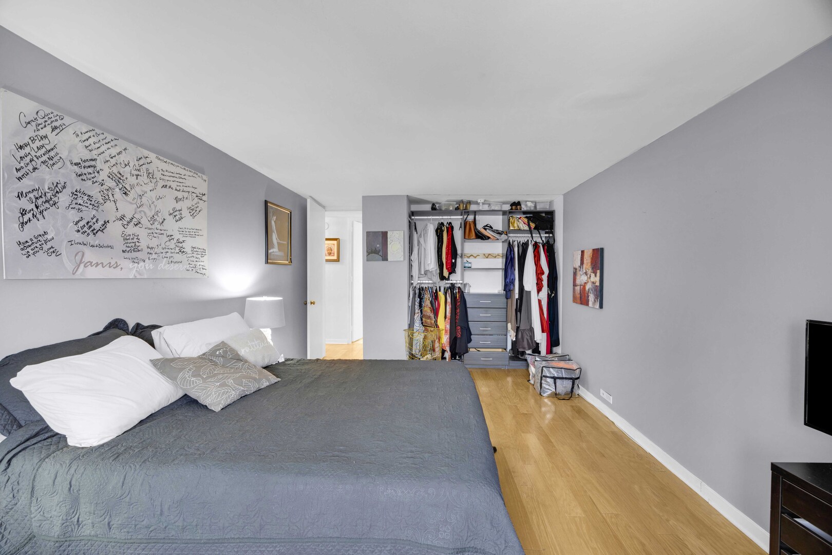 2605 South Indiana Avenue, Unit 403 Chicago, IL 60616 - Photo 15 of 16 a bed room with a bed and a couch