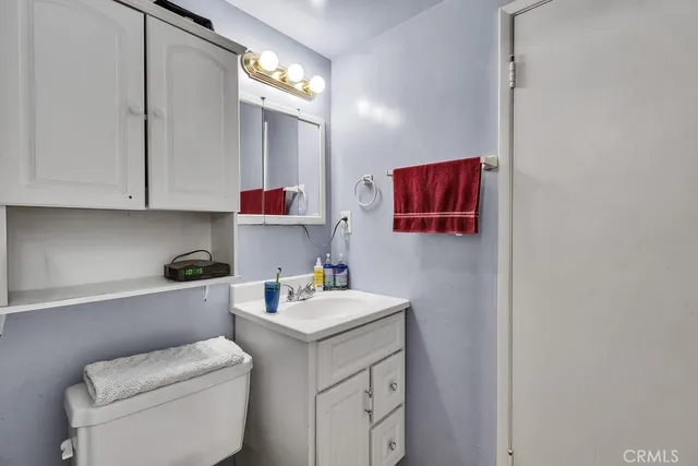 a room with a sink cabinets and utility room